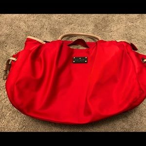 Red Kate Spade diaper bag with changing pad